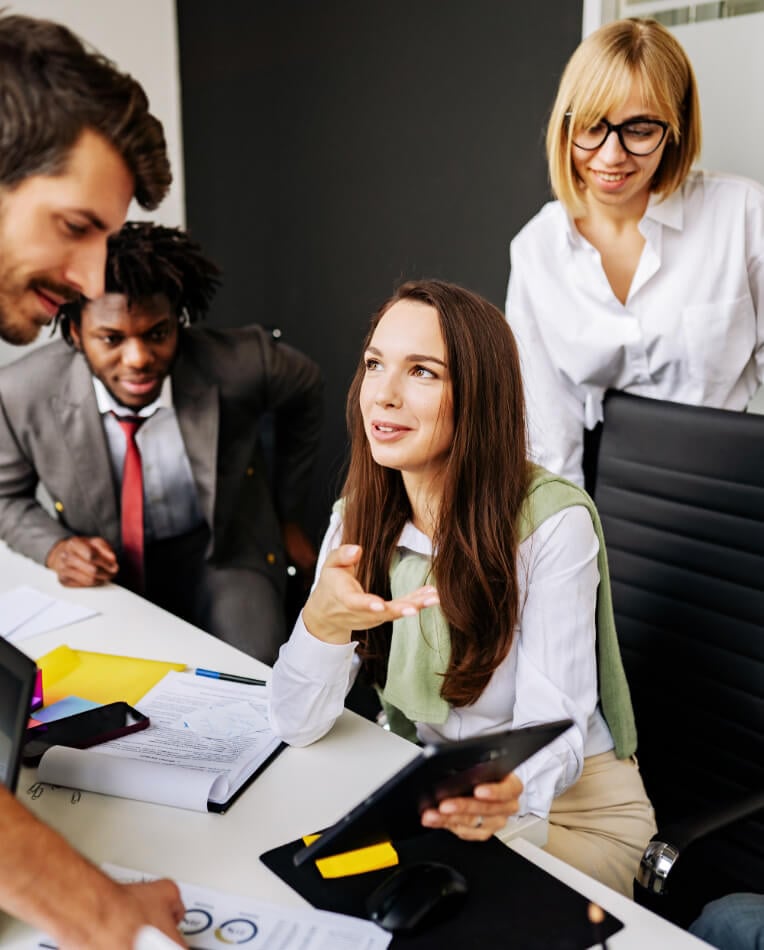 four people in  a meeting